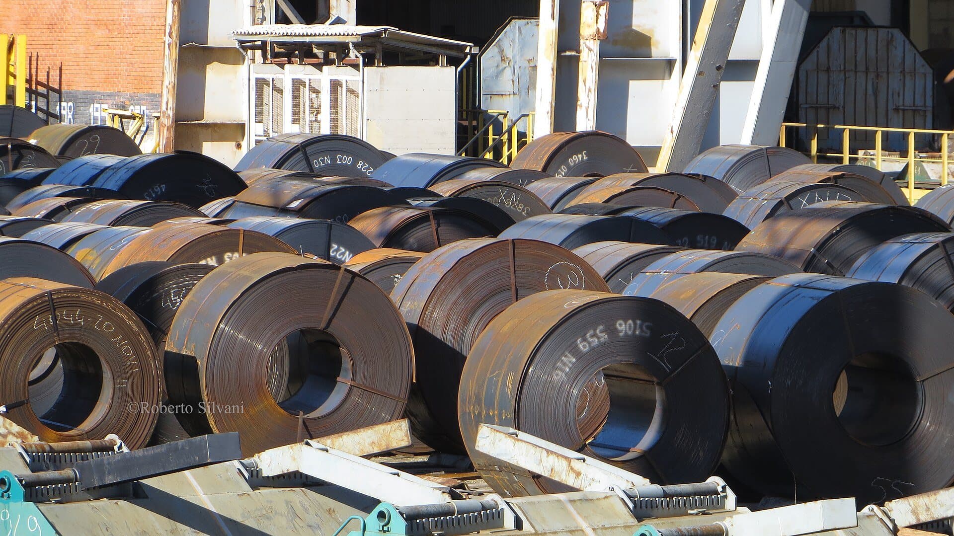 Hot-rolled steel coils in a storage yard
